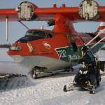 A watchful eye by the outrider, Brian Wilson, on a snowmobile