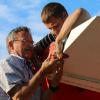 Dennis Lang and our FARS, AME Summer Student Braeden Heffren, working on the last bolt to go in place.